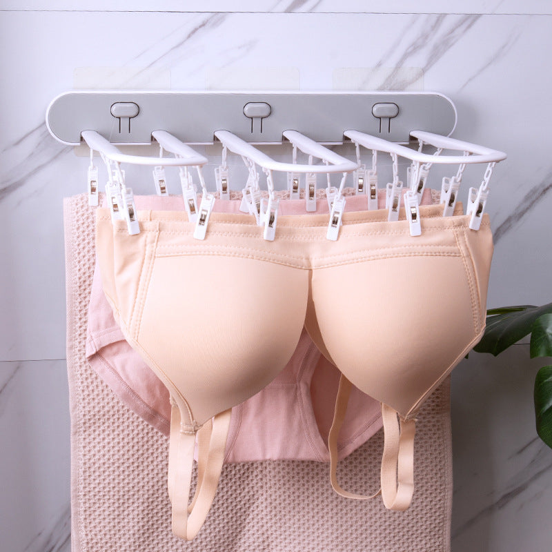Étendoir à linge pour balcon avec plusieurs pinces à linge