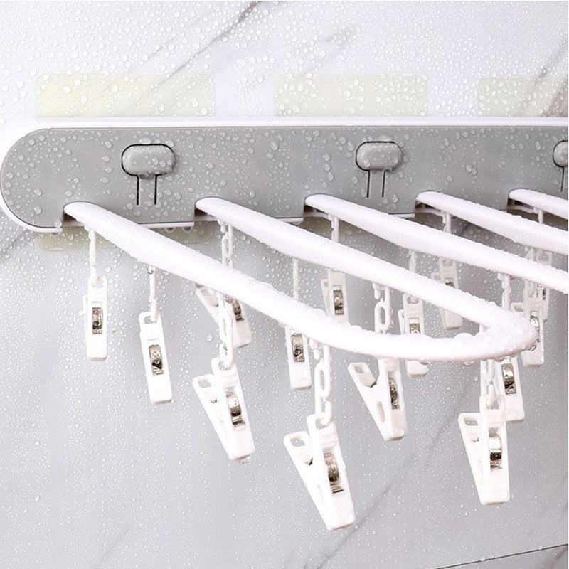 Étendoir à linge pour balcon avec plusieurs pinces à linge